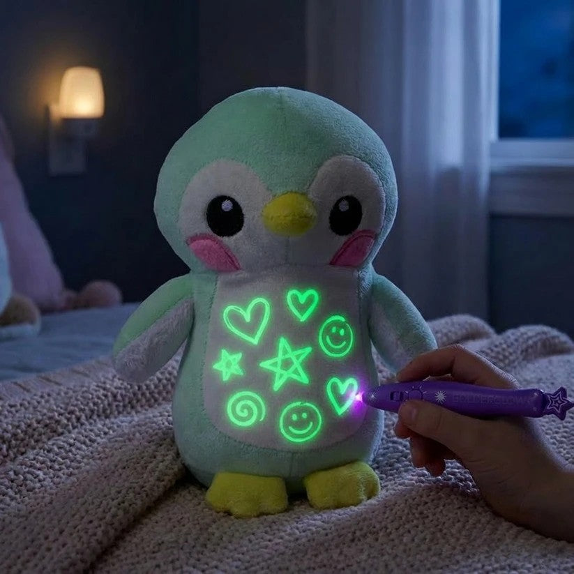 Peluche pingüino brillando en la oscuridad con dibujos de luz